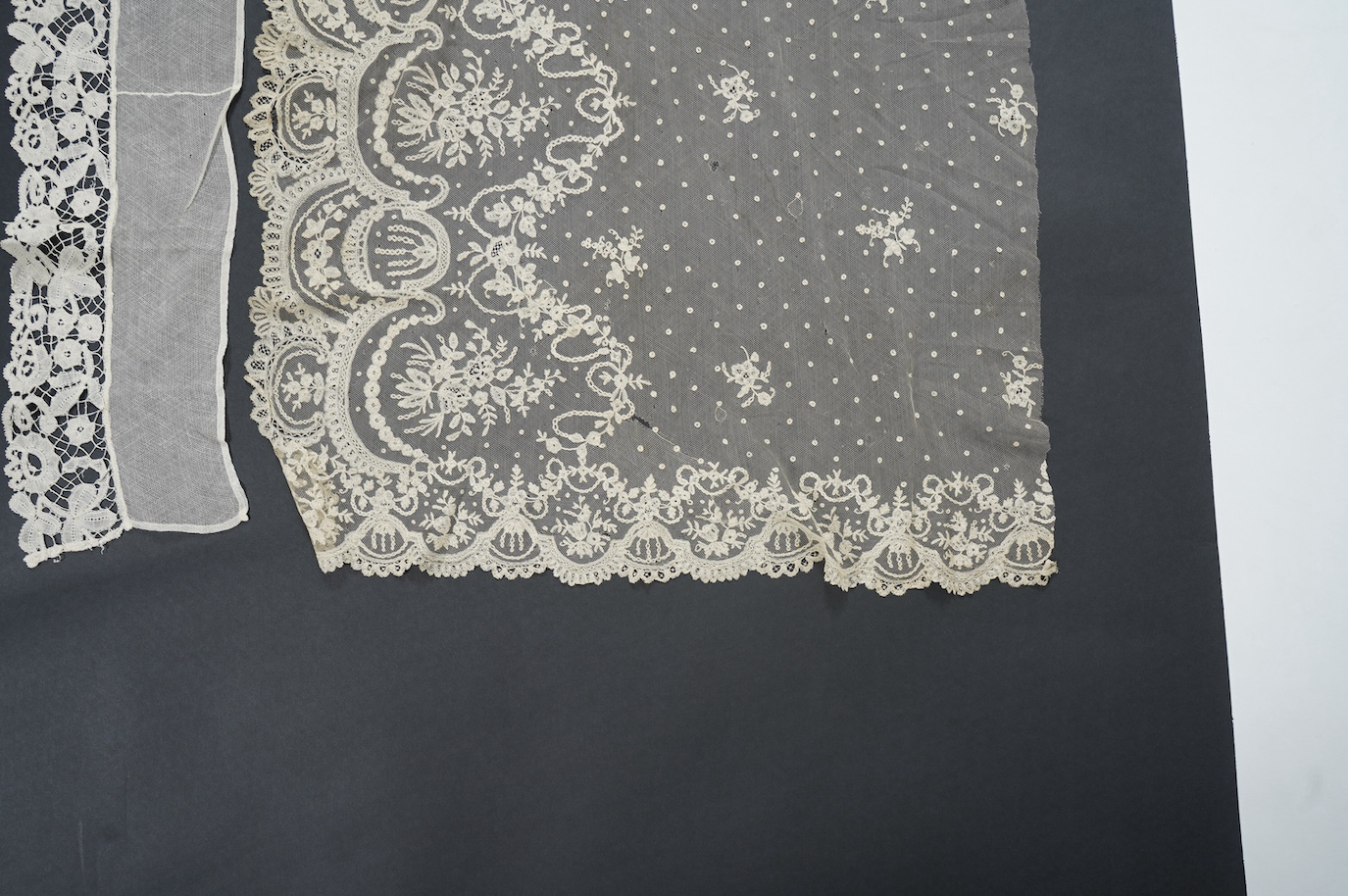 A late 19th century Brussels bobbin lace on net section of a wedding veil, Brussels bobbin lace collar, a point de gaz lace motif and two lengths of later bobbin lace trimming possibly Honiton with needle lace insertions